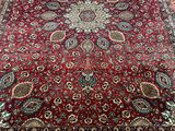 a red rug with a medallion design on it