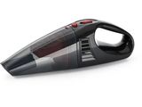 a close up of a black and red vacuum cleaner on a white surface