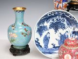 three vases sitting next to each other on a table