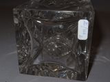 a glass container with a label on it on a table