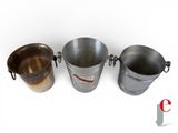 three metal buckets sitting next to each other on a white surface