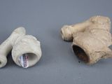 two pieces of clay sitting next to each other on a table