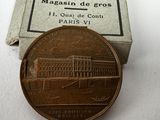 a coin that is sitting on a table next to a box