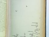 an open book with a picture of a map on it