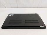 a black laptop sitting on a white surface