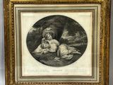 une vieille photo représentant une femme et un enfant dans un décor boisé