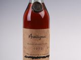 an old bottle of wine sitting on top of a table