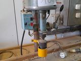 a machine that is sitting on a workbench in a workshop