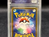 a close up of a pokemon trading card in a clear plastic holder