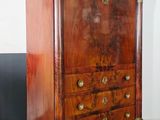 an image of a wooden chest of drawers on a hard wood floor