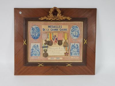 an old framed picture of medals and medals on display in a wooden frame