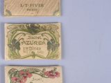 four different types of perfume labels on a white surface