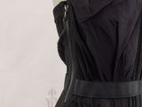 a black dress with zippers on it on a mannequin