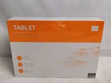 an orange and white box of a tablet on a white surface