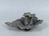 a small metal object that is sitting on a table