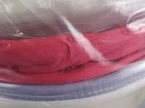 a pile of folded towels in a plastic bag