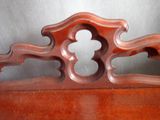 a wooden bench with a mirror on top of it