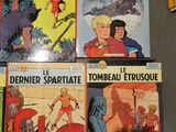 several comics are lined up on a table next to each other