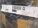 a label on the back of a box that is wrapped in plastic