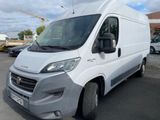 a picture of a white van parked in a parking lot