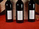three bottles of wine sitting next to each other on a table