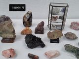 many different types of rocks on display on a table
