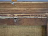 a piece of wood that has been stripped off of the frame
