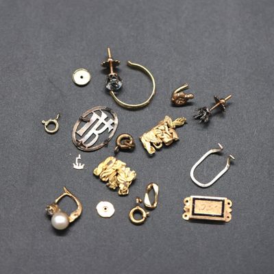 a bunch of different types of jewelry on a black surface