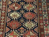 an antique persian rug with a blue and red design