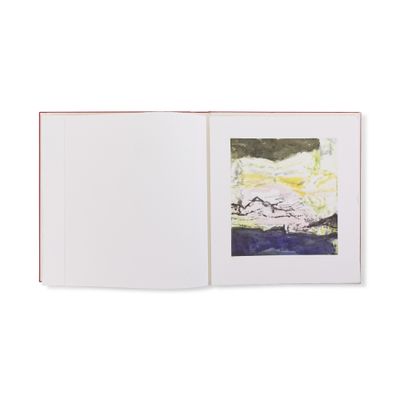 un livre ouvert sur lequel figure l'image d'un paysage