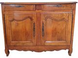 a wooden cabinet with two doors and a drawer underneath it