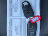 a picture of a car key on a paper with a red tag