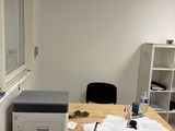 a desk with a printer and a printer on it
