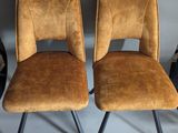 pair of mid century style chairs in brown velvet with black metal legs
