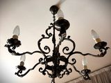 a chandelier that has a lot of lights hanging from it