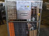 a metal cart with a bunch of boxes on top of it