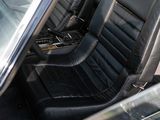 an image of the inside of a car with black leather seats