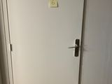 a white door with a yellow sticker on it