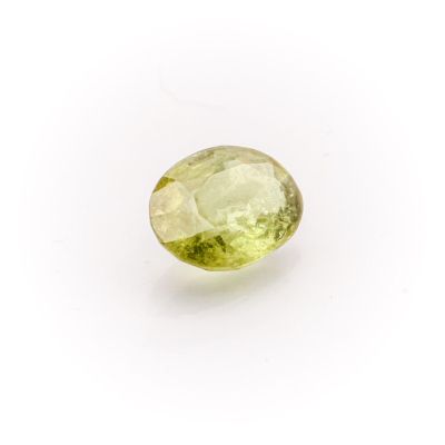 a green tourmaline gemstone on a white background