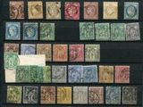 an old collection of postage stamps on a black background