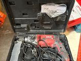 a tool case with tools in it sitting on the floor