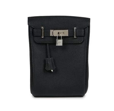 a black leather handbag with a lock on the front