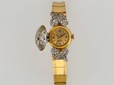 an image of a gold and diamond watch on a white surface