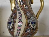 a vase that is sitting on a shelf in a room