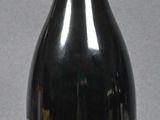 a bottle of wine that is sitting on a table