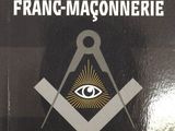une image représentant un livre orné d'un symbole maçonnique