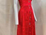 red and white polka dress on a mannequin base