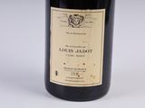 a bottle of wine that is sitting on a table