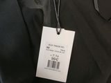the back of a black jacket with a tag on it
