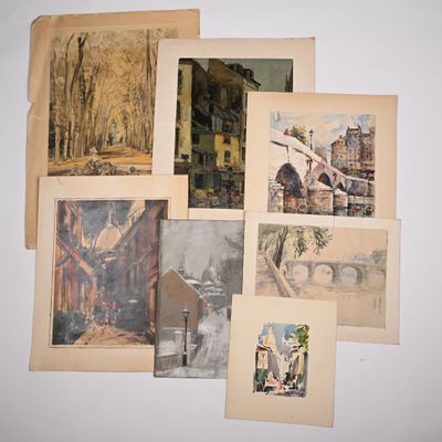 a lot of pictures hanging on the wall of a room
